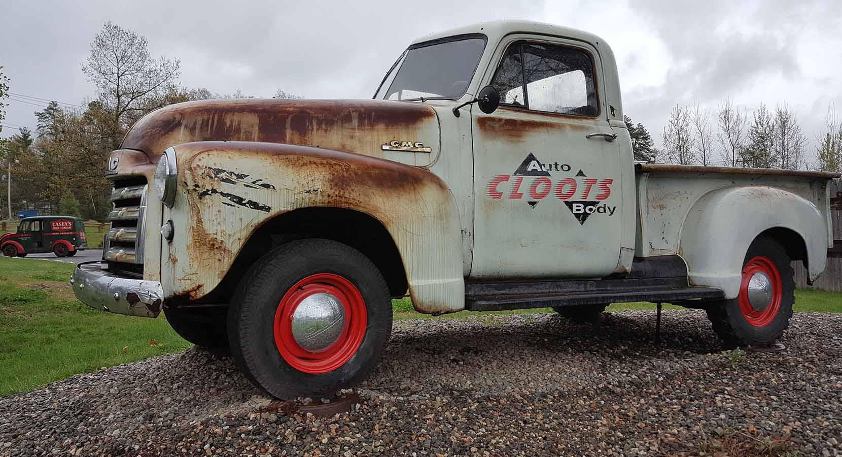 Vintage GMC truck with Cloot's Auto Body signage — Westfield, MA collision repair shop